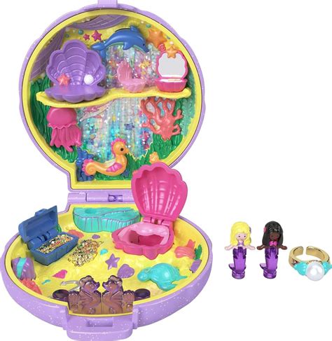 Polly pocket keepsake collection - The Polly Pocket Keepsake Collection Mermaid Dreams compact is from the collection vault and has never been seen before until now! The compact opens to reveal a colorful undersea world with a brilliantly colored holographic background that really shimmers, 2 mermaid dolls, and carefully crafted ocean details.